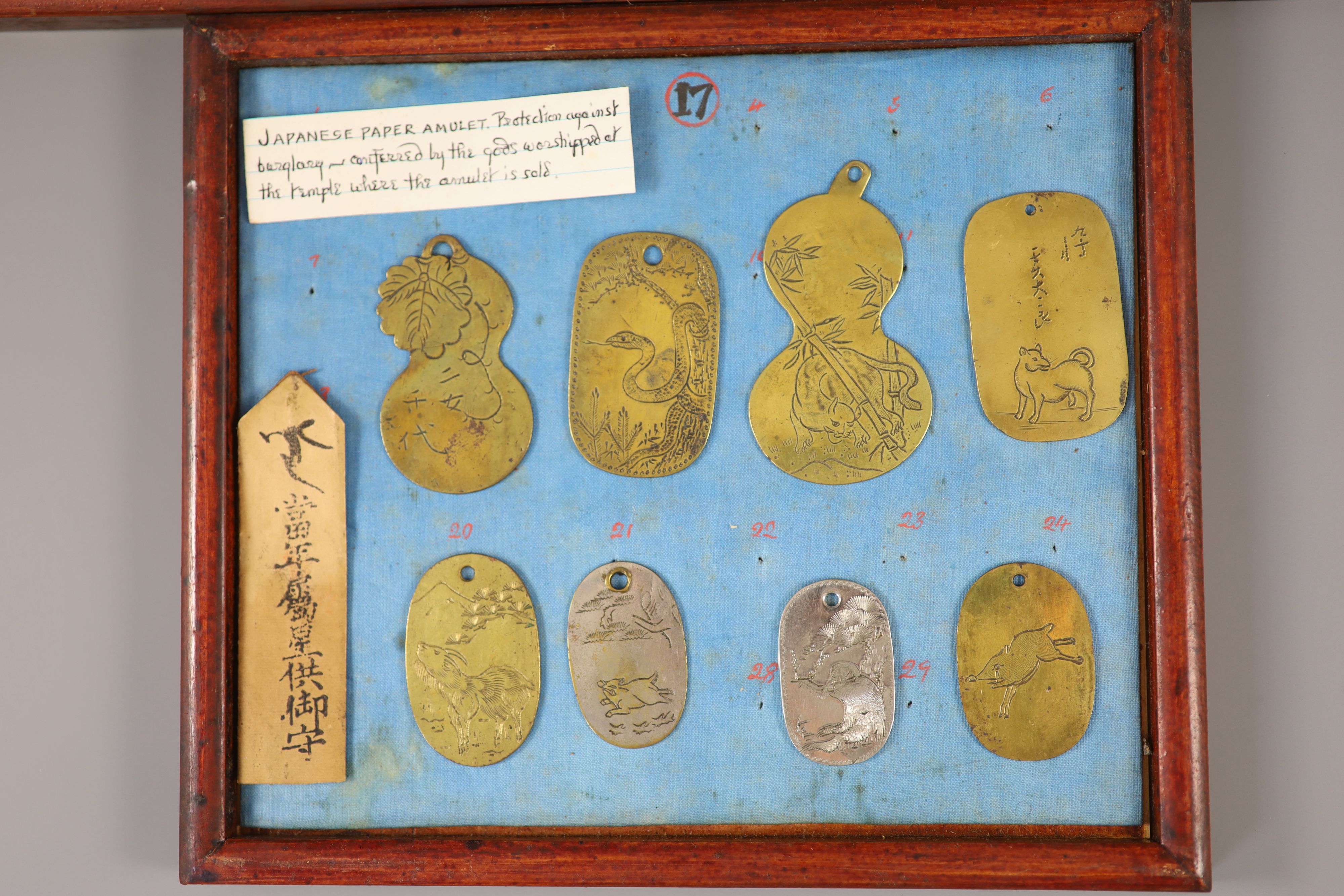 A group of 40 Japanese bronze and metal amulets or charms, 19th/20th century,